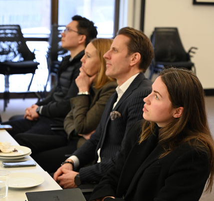 Participants at the roundtable session taking in Jonas Hammerschmitd's findings.